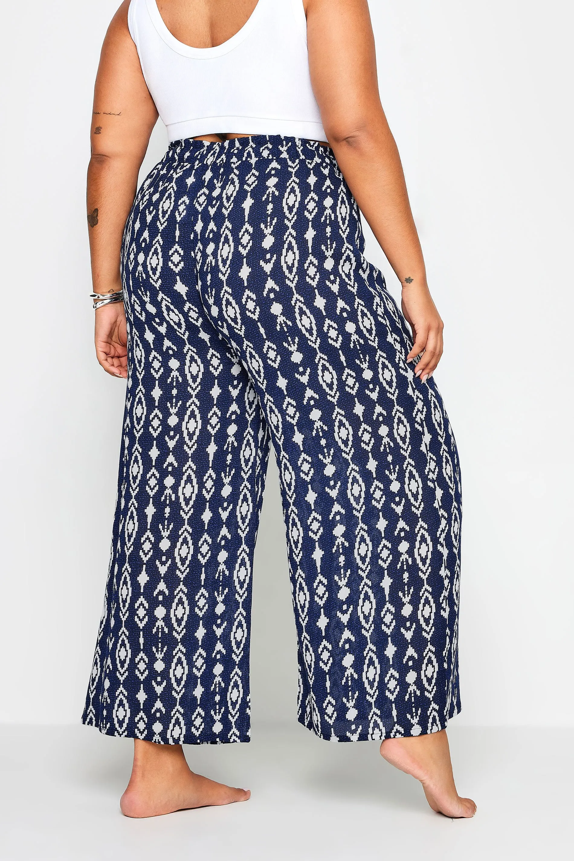 YOURS Curve Navy Blue Ikat Print Crinkle Tassel Trousers